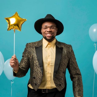 Man suit sunglasses party with balloon