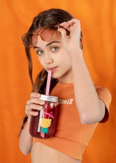 Medium shot girl posing with drink