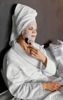 Medium shot woman massaging face