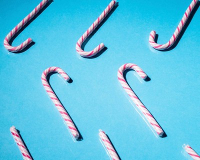 Mint xmas cane candies blue background