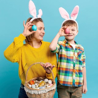 Mother son covering eyes with painted egg