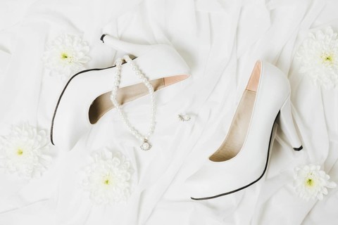 Overhead view chrysanthemum necklace earrings wedding high heels white scarf
