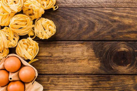 Pasta near egg carton