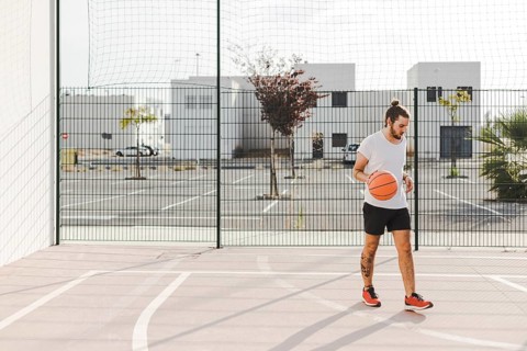 Portrait baskeball player standing court