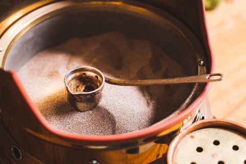 Preparation turkish coffee cezve sand cafe bar