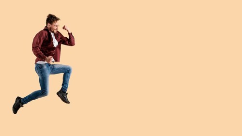Side view young handsome man jumping 2