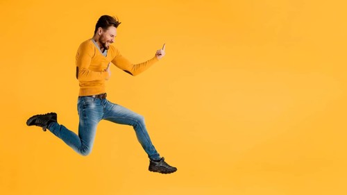 Side view young man jumping