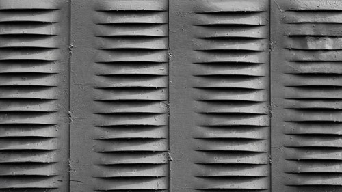 Silver wall with ventilation holes