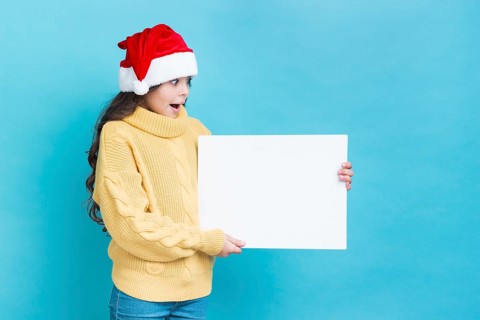 Surprised girl with poster mockup hands