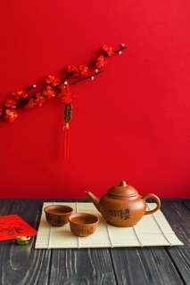 Tea set lumber tabletop near branch