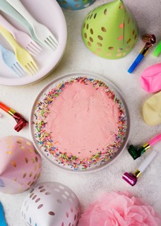 Top view arrangement with pink cake decorations
