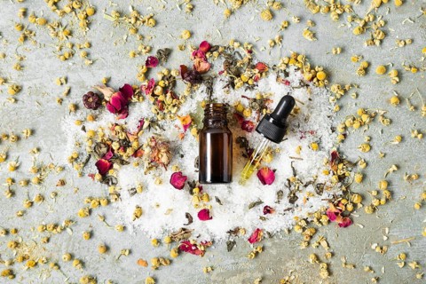 Top view centered bottle with natural skin products