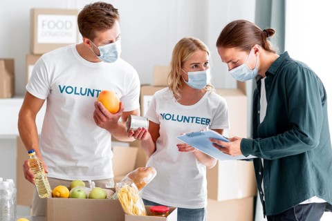 Volunteers helping packing donations world food day