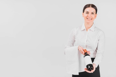 Waitress woman offering bottle wine