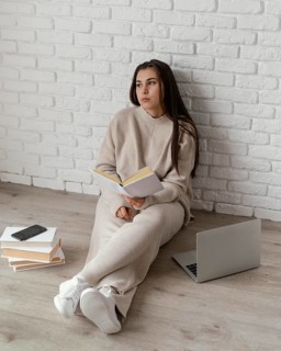 Woman floor with book laptop