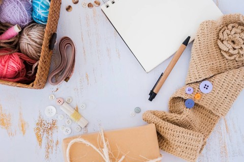 Wool balls basket measuring tape button crochet wooden desk