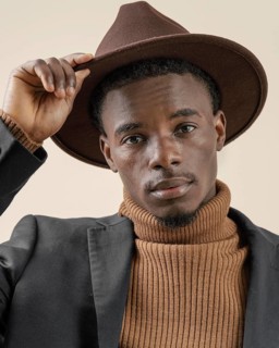 Young handsome man posing with hat 3