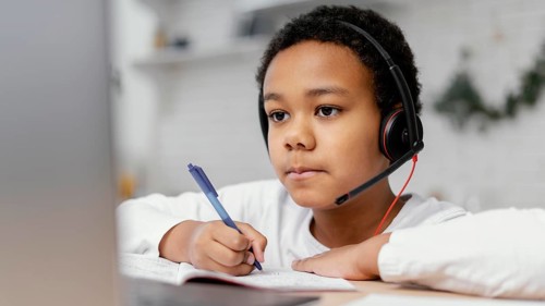Boy doing homework with use laptop 3