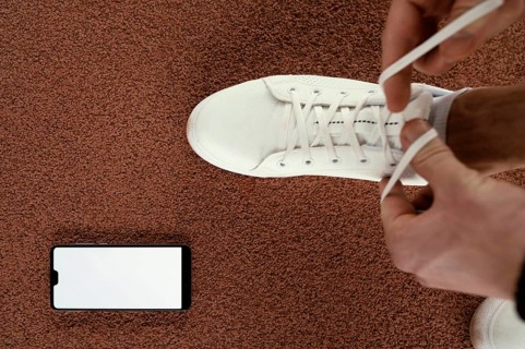 Close up athlete tying shoelaces