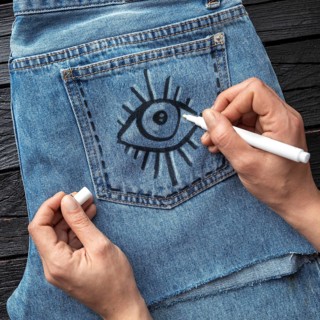Close up hand drawing jeans