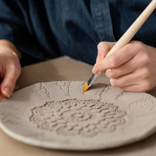 Close up hand holding brush 2