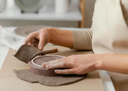 Close up hands doing pottery 3