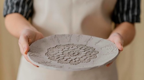 Close up hands holding plate