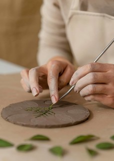 Close up hands working with plant