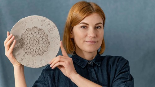 Close up smiley woman holding plate