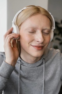 Close up smiley woman with headphones