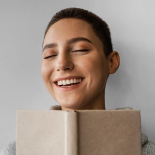 Close up smiley woman with notebook