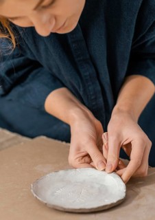 Close up woman making plate