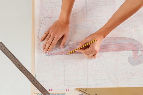 Close up woman measuring with ruler