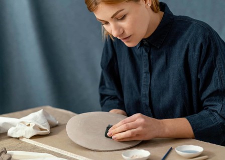 Close up woman wiping plate