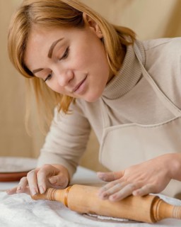 Close up woman with rolling pin
