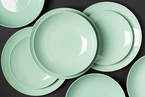 Composition different sized plates black background