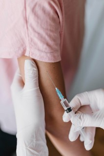 Doctor giving kid vaccine