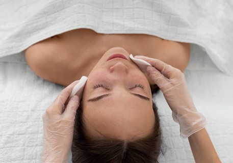 Female client salon face care routine with cleansing disks 3