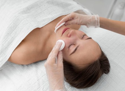 Female client salon face care routine with cleansing disks 6
