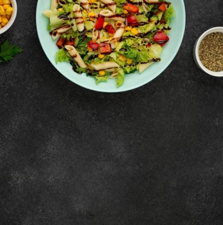 Flat lay salad with chicken balsamic vinegar with copy space