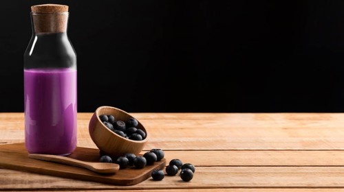 Front view purple smoothie blueberries with copy space