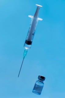 Front view syringe with vaccine close up