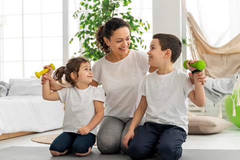 Full shot adult kids with dumbbells