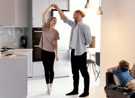 Full shot partners dancing home