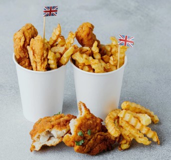 High angle fish chips paper cups with great britain flags