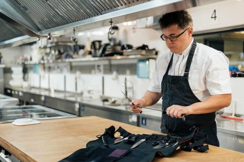 Male chef kitchen preparing his tools