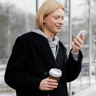Medium shot woman checking phone
