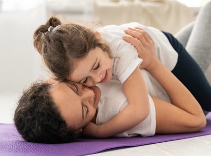 Medium shot woman holding girl
