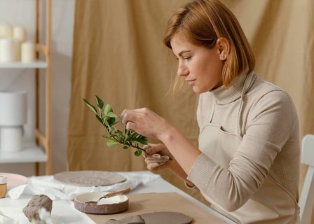 Medium shot woman holding twig