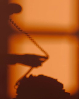 Silhouette woman using telephone 2